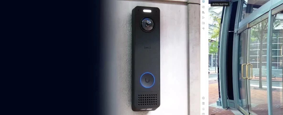 Access reader installed beside an entrance with glass doors