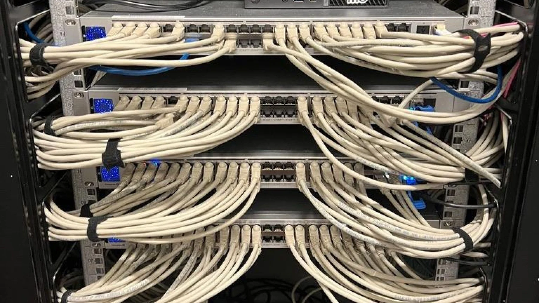 Network patching and cables installed in a working equipment rack