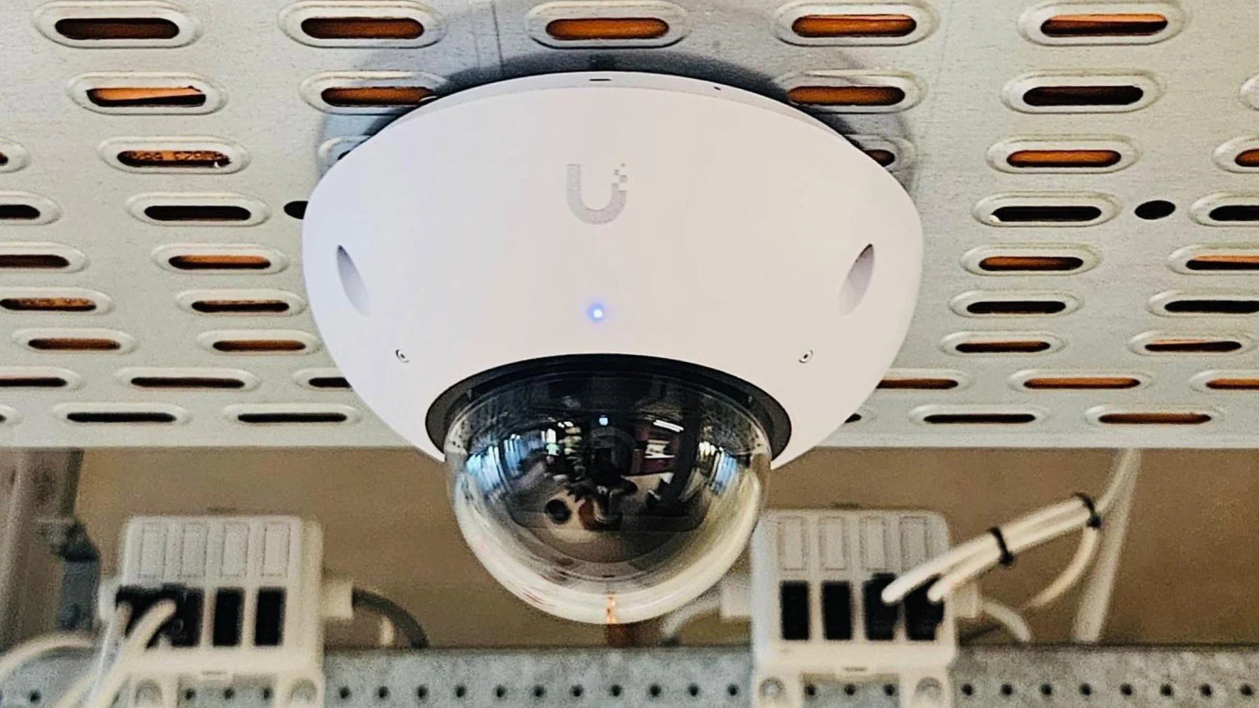 A dome camera installed within a working business property